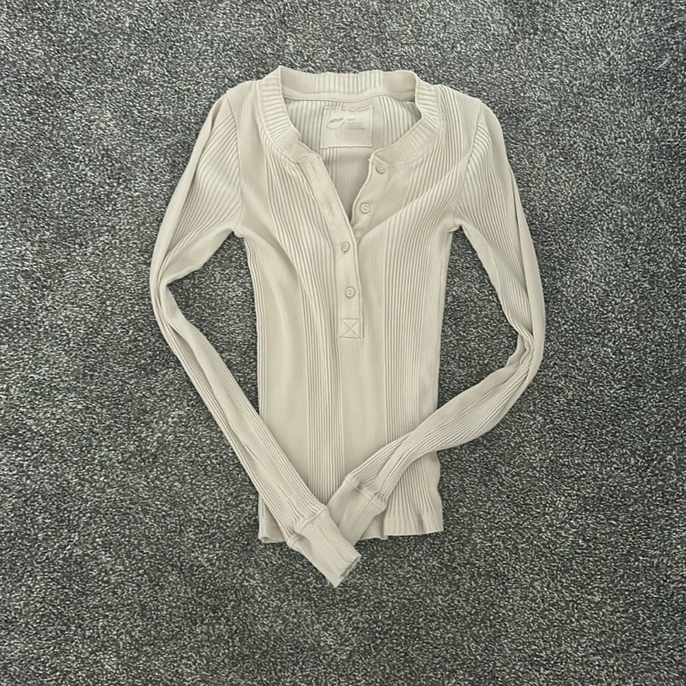 Cream colored long sleeved shirt